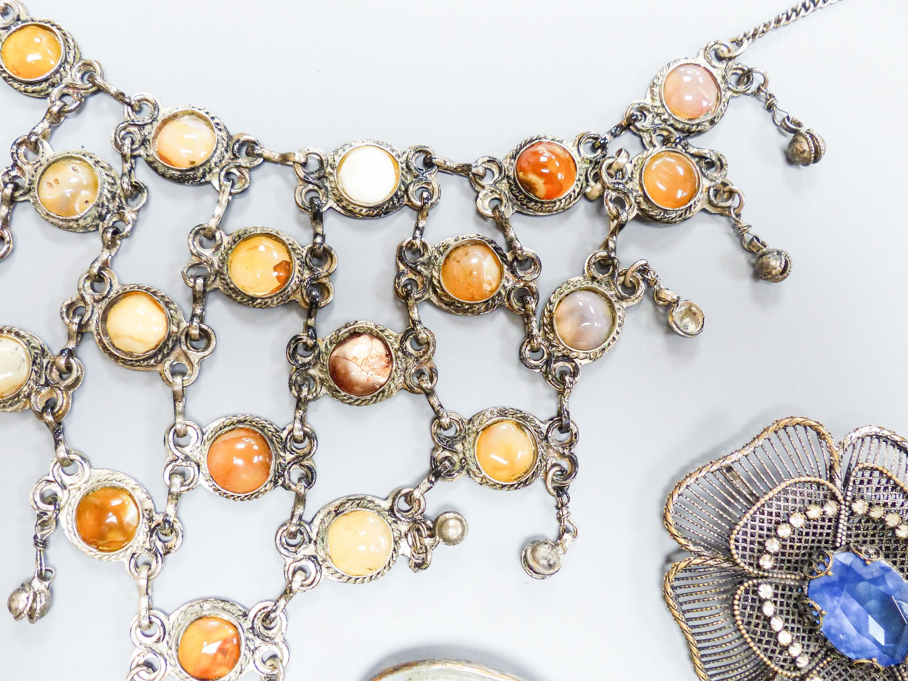 A base metal and agate mounted necklace and other costume jewellery.